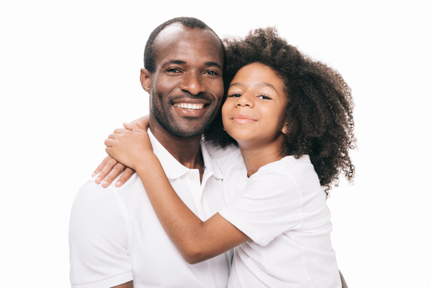 african american father and daughter hugging - 写真・画像