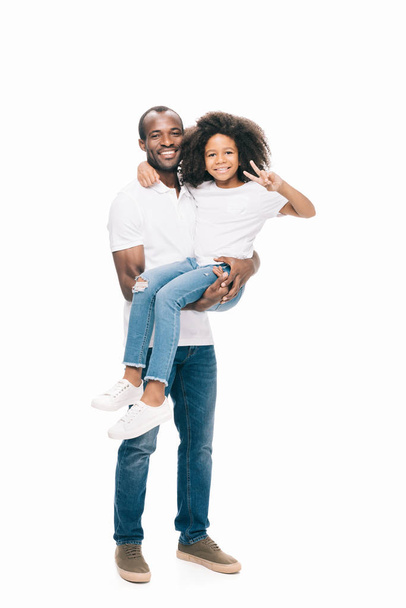 african american father carrying daughter - 写真・画像