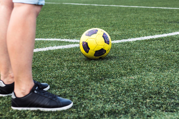 feet of woman in sneakers and soccer ball - Fotoğraf, Görsel