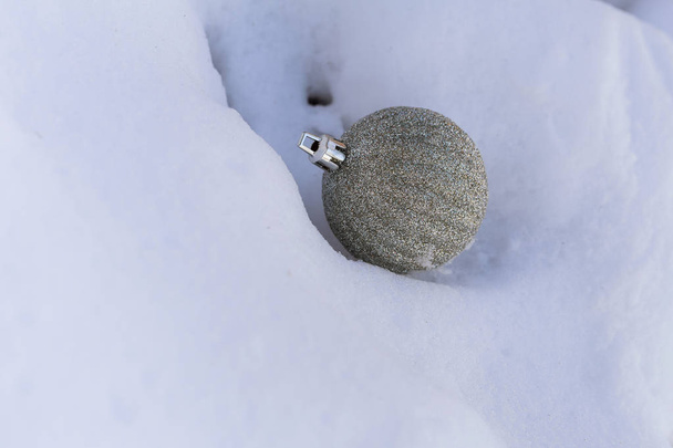 silver christmas ball with snow on white Christmas balls on snow - Фото, изображение