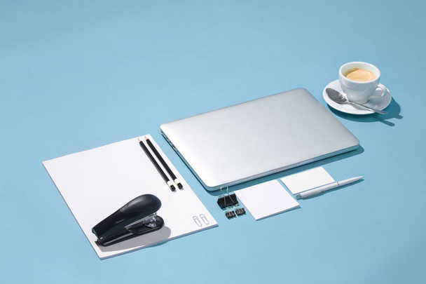 The laptop, pens, phone, note with blank screen on table - Zdjęcie, obraz
