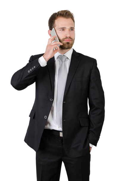 Portrait of a handsome businessman talking on the phone - Fotó, kép