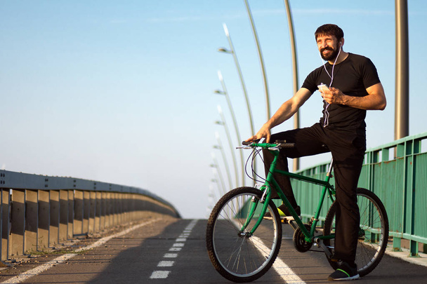 cyclist with earphones - Photo, Image