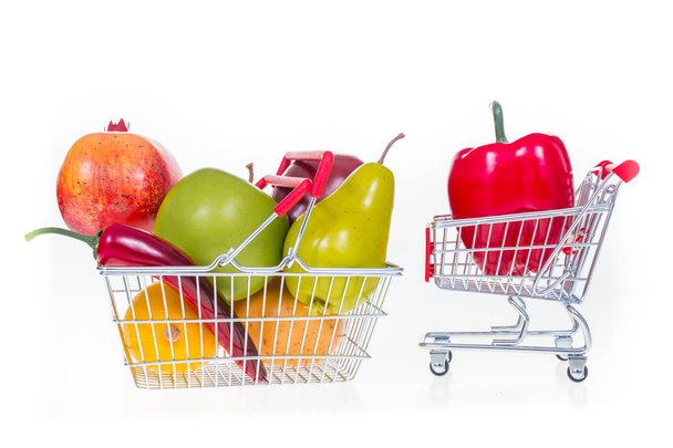 Shopping cart and shopping basket full with fruits and vegetable - Zdjęcie, obraz