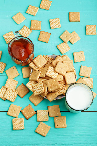 tasty breakfast crackers with jam and milk on a wooden surface,  - 写真・画像