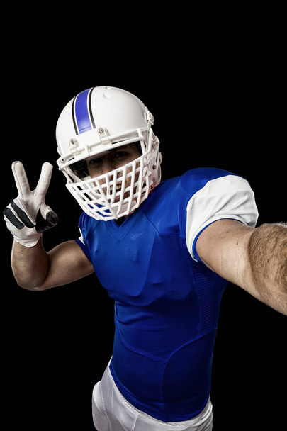 Football Player with a blue uniform - 写真・画像