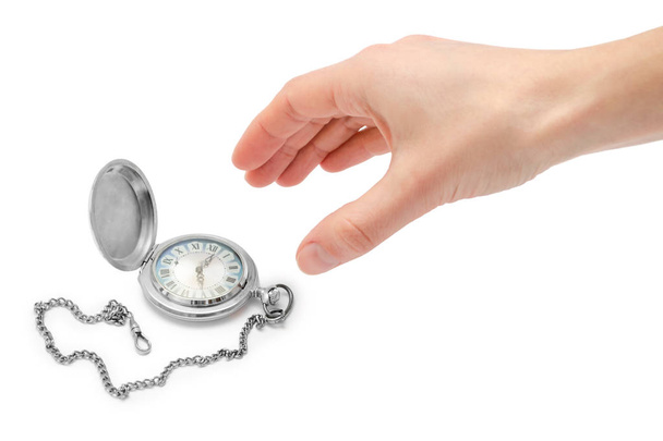 female hand takes or gives pocket watch. - Photo, Image