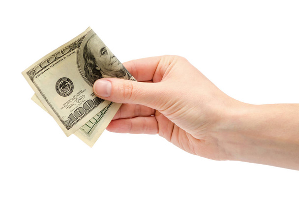 female hand takes or gives one hundred US dollars. - Φωτογραφία, εικόνα
