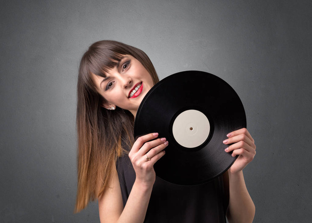 Lady holding vinyl record - Fotoğraf, Görsel