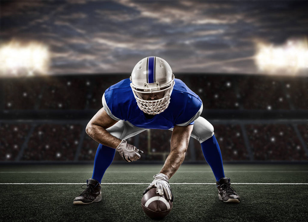 Football Player with a blue uniform - Foto, afbeelding