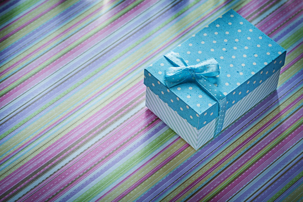 Gift box on striped background directly above celebrations conce - Fotó, kép