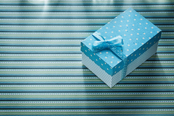 Gift box on stripy tablecloth celebrations concept - Photo, Image