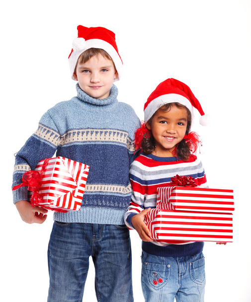 Little kids in Santa's hat with gift box - Fotoğraf, Görsel