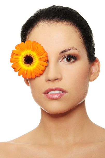 Attractive girl without a make-up, with flower on eye - Foto, Imagen