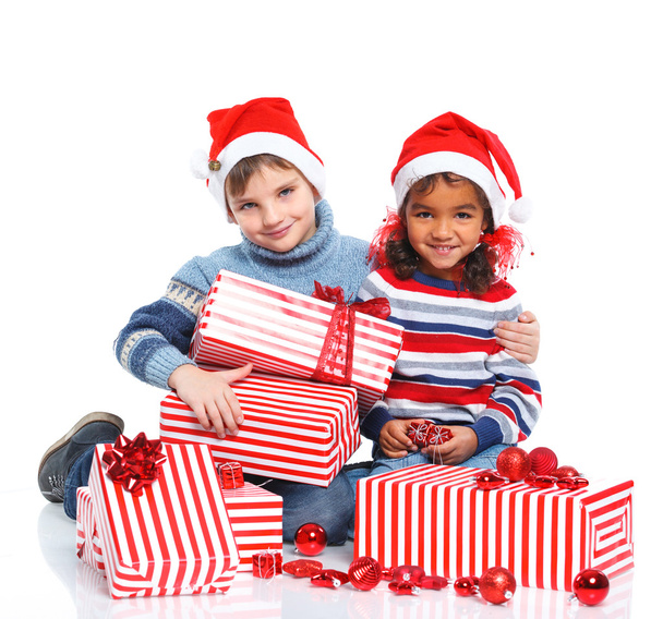 Little kids in Santa's hat with gift box - Photo, Image