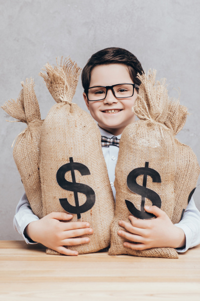 little boy with moneybags - Foto, Imagem
