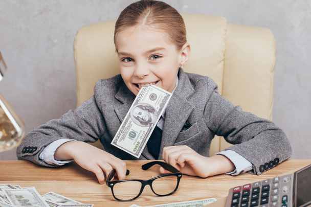 little child with money at workplace - Photo, Image