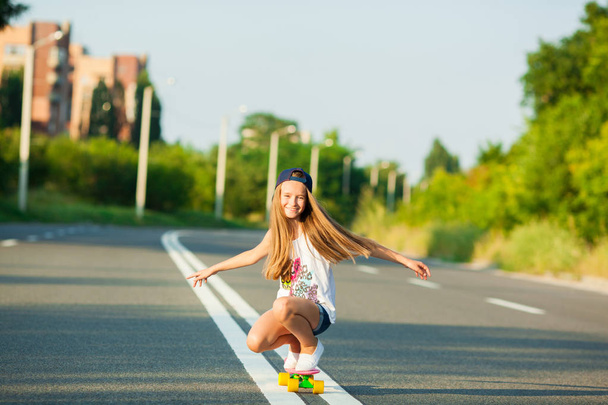 A young girl with penny board .  - Photo, Image