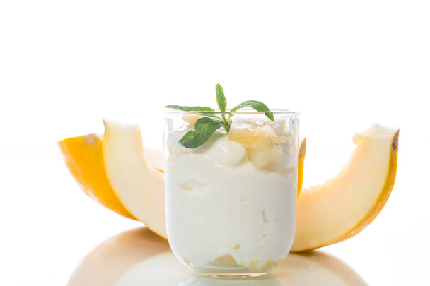 Homemade yogurt with slices of ripe melon - Photo, image
