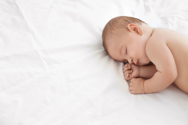 Cute little baby sleeping on bed at home - 写真・画像