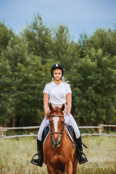 Girl jockey riding a horse - Photo, Image