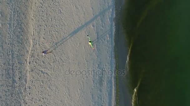 Aerial Shot of a Woman Going to a Man and hugging each other with Love on Sandy Beach
 - Кадры, видео