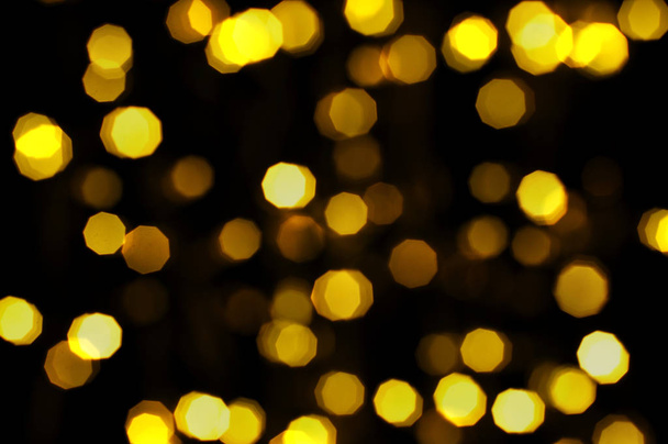 Defocused bokeh lights in blur night background - Foto, afbeelding