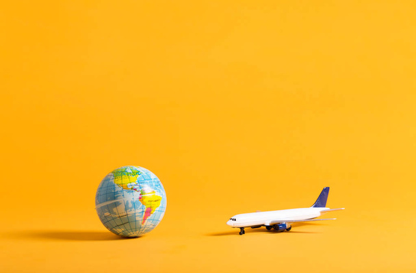 Travel theme with airplane and globe - Фото, зображення