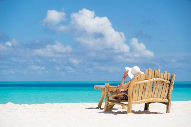 Young beautiful woman enjoying summer vacation, beach relax, sum - Photo, Image