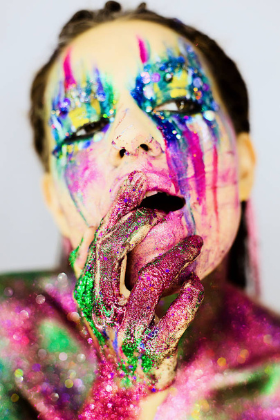 Close up portrait of a beautiful girl with creative glitter make up - Фото, изображение