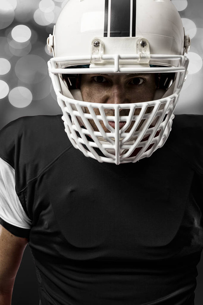 Football Player with a Black uniform - Foto, afbeelding