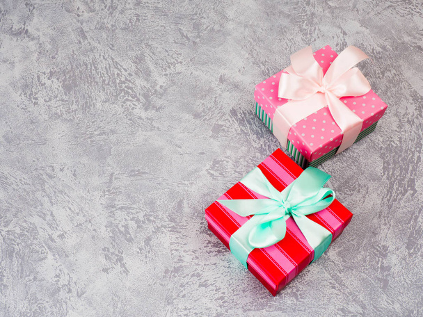 Gift boxes with bow on grey background. Decoration. - Zdjęcie, obraz