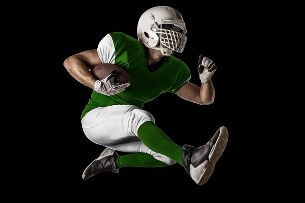 Football Player with a green uniform - Fotó, kép