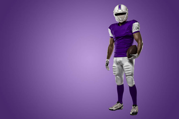 Football Player with a purple uniform - Foto, immagini
