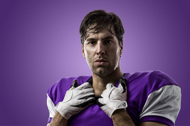 Football Player with a purple uniform - Foto, afbeelding