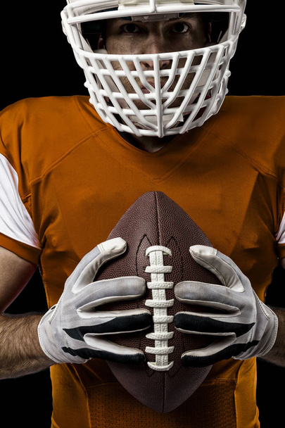 Football Player with a orange uniform - Φωτογραφία, εικόνα