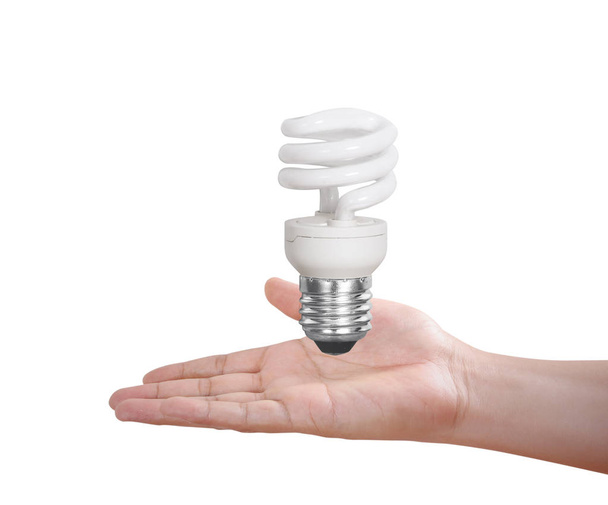 hand holding a light bulb with energy  - Foto, Imagem
