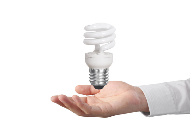 mão segurando uma lâmpada com energia
  - Foto, Imagem
