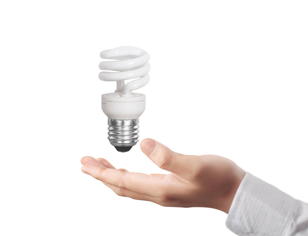 hand holding a light bulb with energy  - Photo, Image