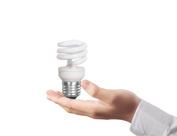 mão segurando uma lâmpada com energia
  - Foto, Imagem