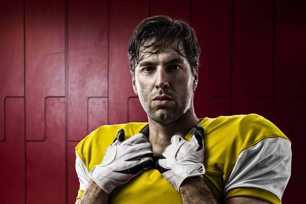 Football Player with a yellow uniform - Foto, Bild