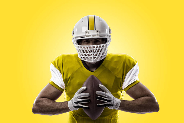 Football Player with a yellow uniform - Foto, afbeelding