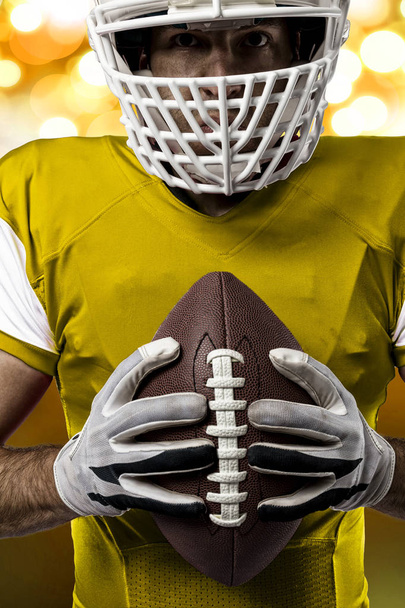 Football Player with a yellow uniform - 写真・画像