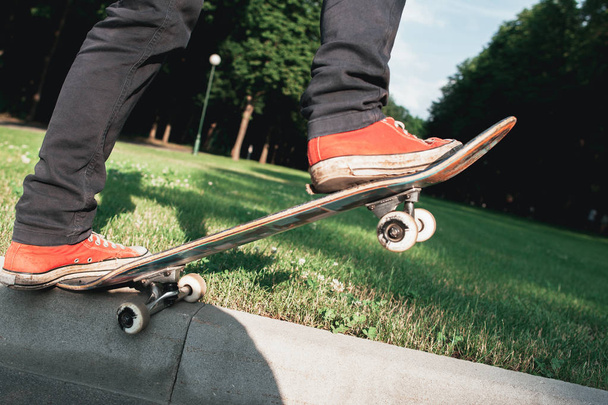 Skateboarder make back slide trick on park - 写真・画像