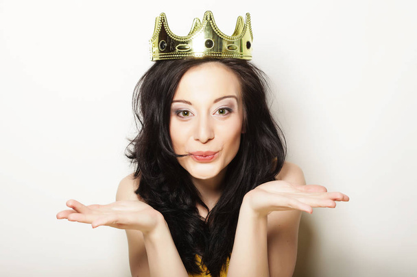 pretty brunette woman wearing crown - Photo, image