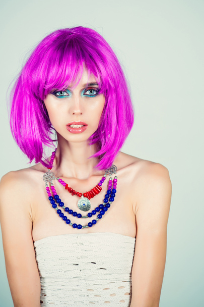 Woman in violet wig with fashionable makeup. - Фото, зображення