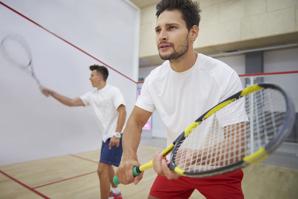 two men playing squash - Фото, изображение