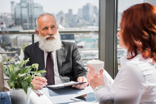 mature business people having meeting - Фото, изображение