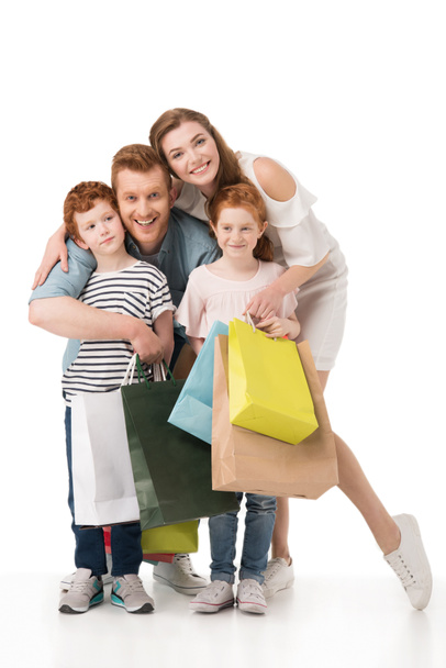 happy family with shopping bags - Foto, afbeelding