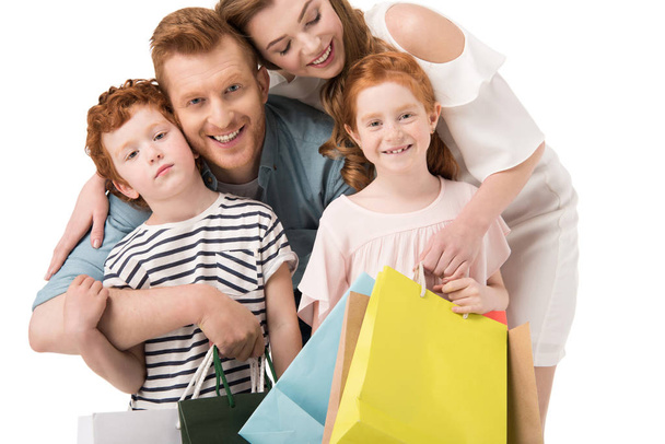 Familia feliz con bolsas de compras
 - Foto, Imagen